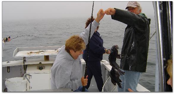 Moe, Jeannie and the
                      gang are having a ball catching black seabass
                      fishing!